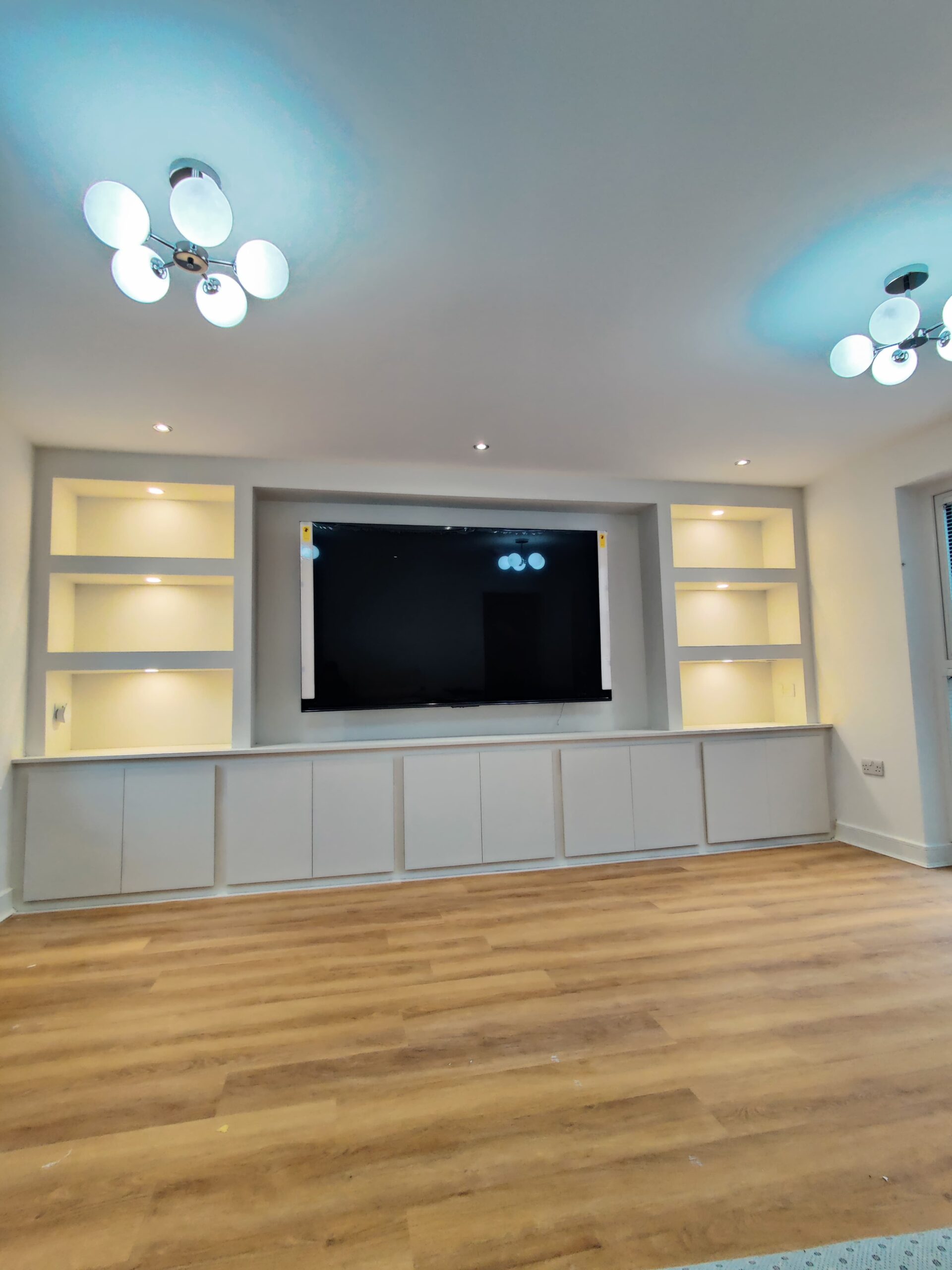 Classic Neutral Media Wall With Shelving and Cabinets