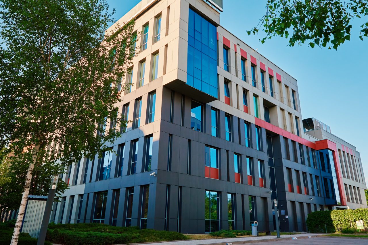modern-office-building-with-green-trees.jpg