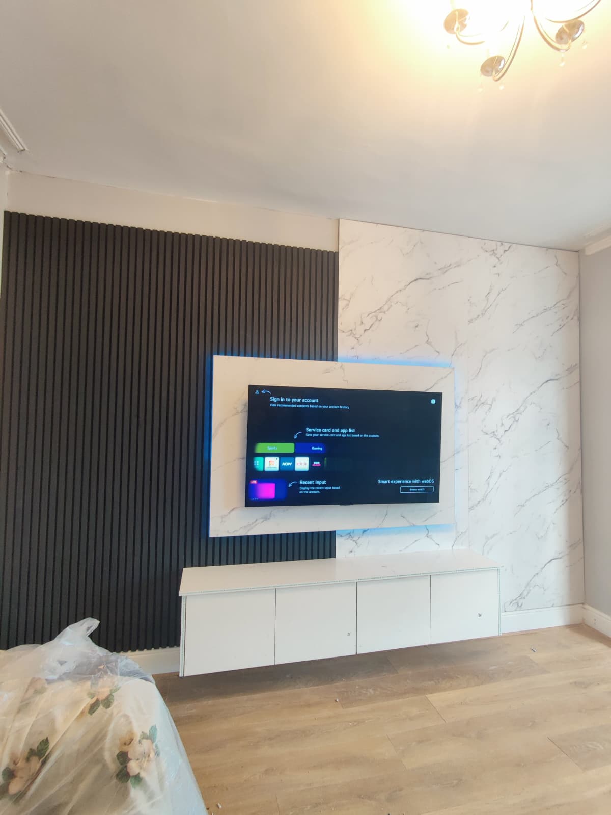 Marble-Style Media Wall With Soft Backlighting
