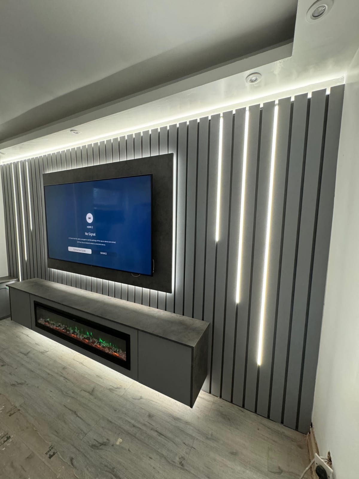 Slatted Panel Media Wall With LED Lighting